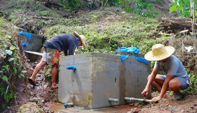 The water from a collection chamber is delivered to the elevated stainless-steel tanks installed within the community and school. 