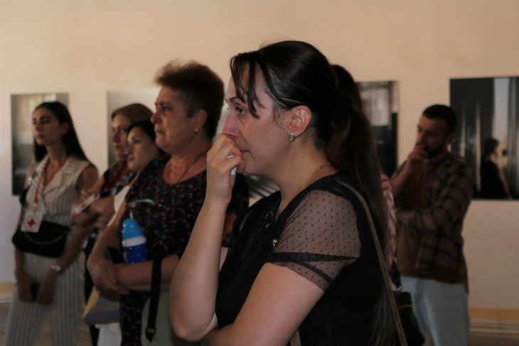 Mother of a missing person attending the exhibition.
