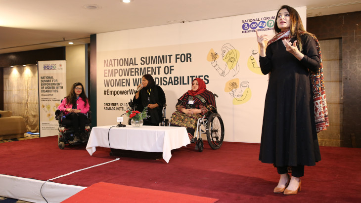Sign language interpreter on stage at the NSEWD