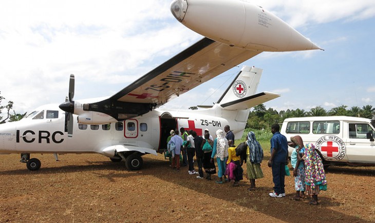 Béni, North Kivu, 2014. 14 children and one adult who had become separated from their familiies board a plane on the way to being reunited with their families in Uganda.