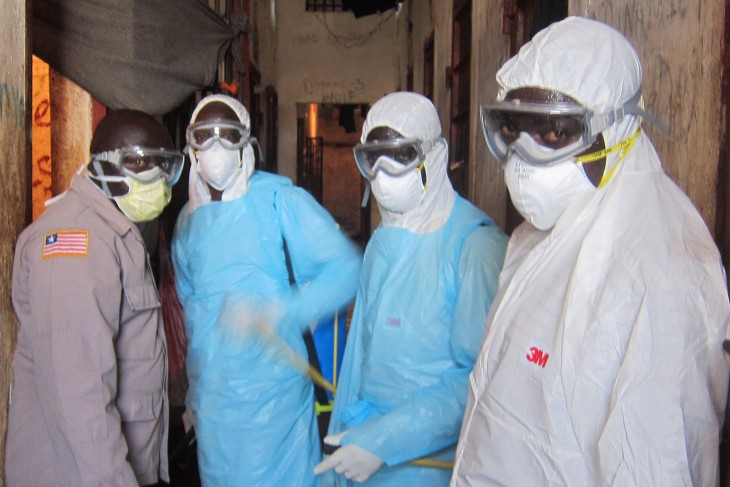 The joint fumigation team of the Ministry of Health and the Bureau of Corrections and Rehabilitation discusses the spraying operation.