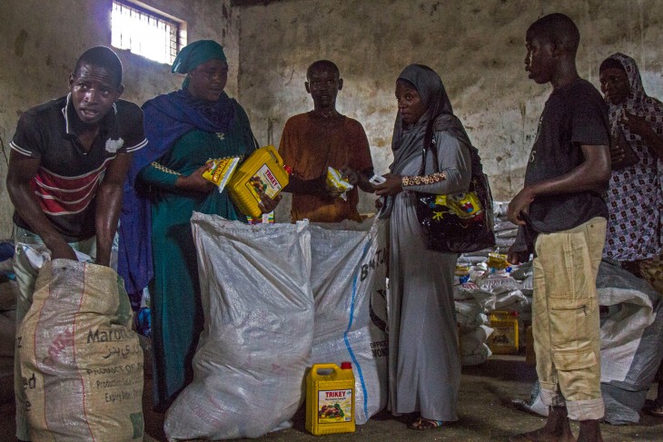 Maiduguri, Nigeria. Memuna collects food from an ICRC distribution centre.