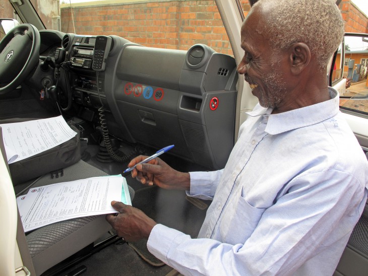 Raymond's father signs the handover certificate for his son.