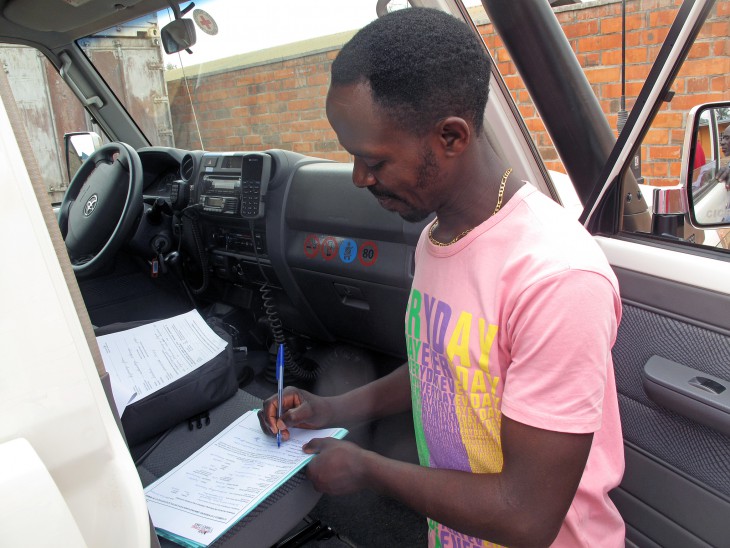 After his father has signed the handover certificate, it's Raymond's turn to sign the paperwork marking the end of 22 years of separation from his family.