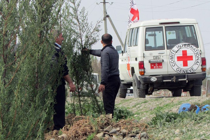 Trees planted along the road will help keep villagers safe from bullets.