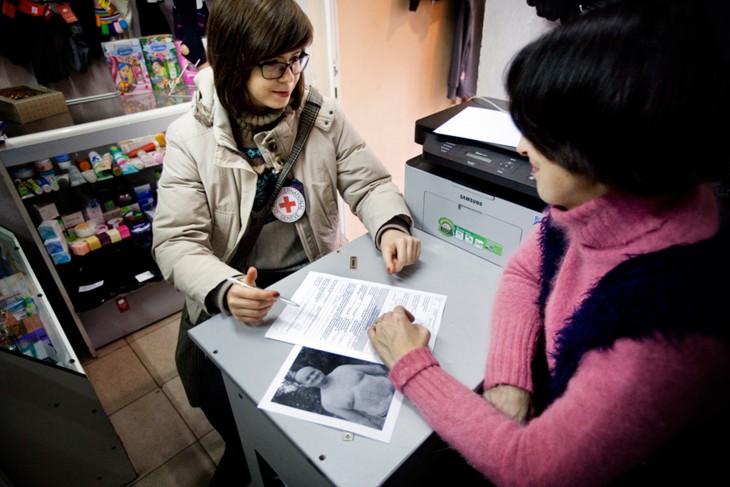 Ukraine. Victoria tells an ICRC employee about her missing husband.