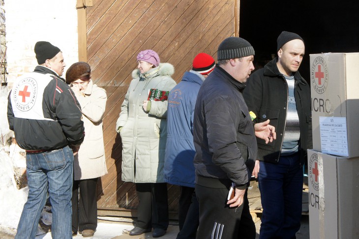 ICRC warehouse, Sviatogorsk, Ukraine. Displaced people collect food and hygiene supplies.