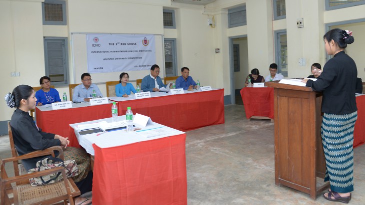 Judges listen to arguments during the trial. 