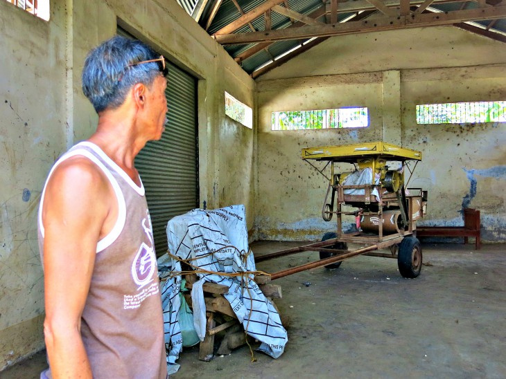 The community corn thresher, sitting idele in the village storehouse