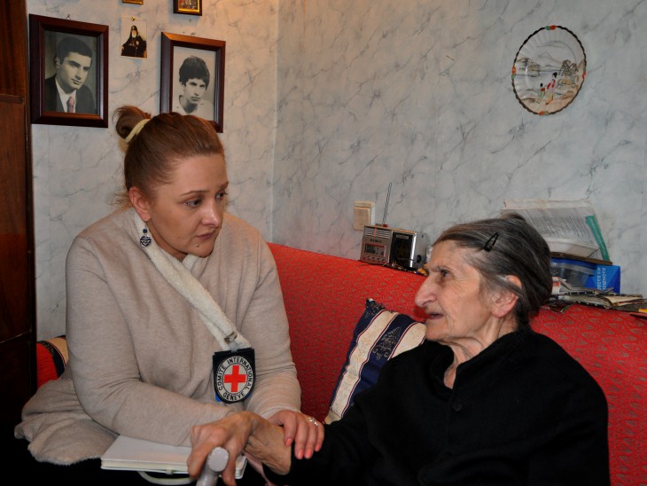 Georgia. Zhuzhuna Okruashvili, whose son was missing 24 years, sits alongside her husband Valerian and signs one of her books in which she expresses her emotions through poetry. CC BY-NC-ND/ICRC