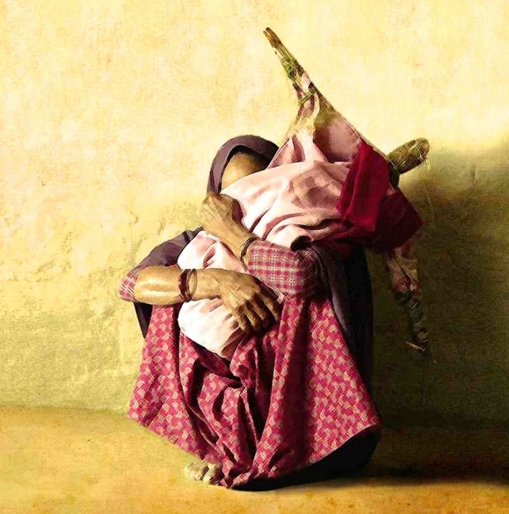 Bhojali Chaudhari tightly holds a doll that represents her missing daughter. As per tradition, the doll is made of sacred grass and is dressed in her daughter’s clothes